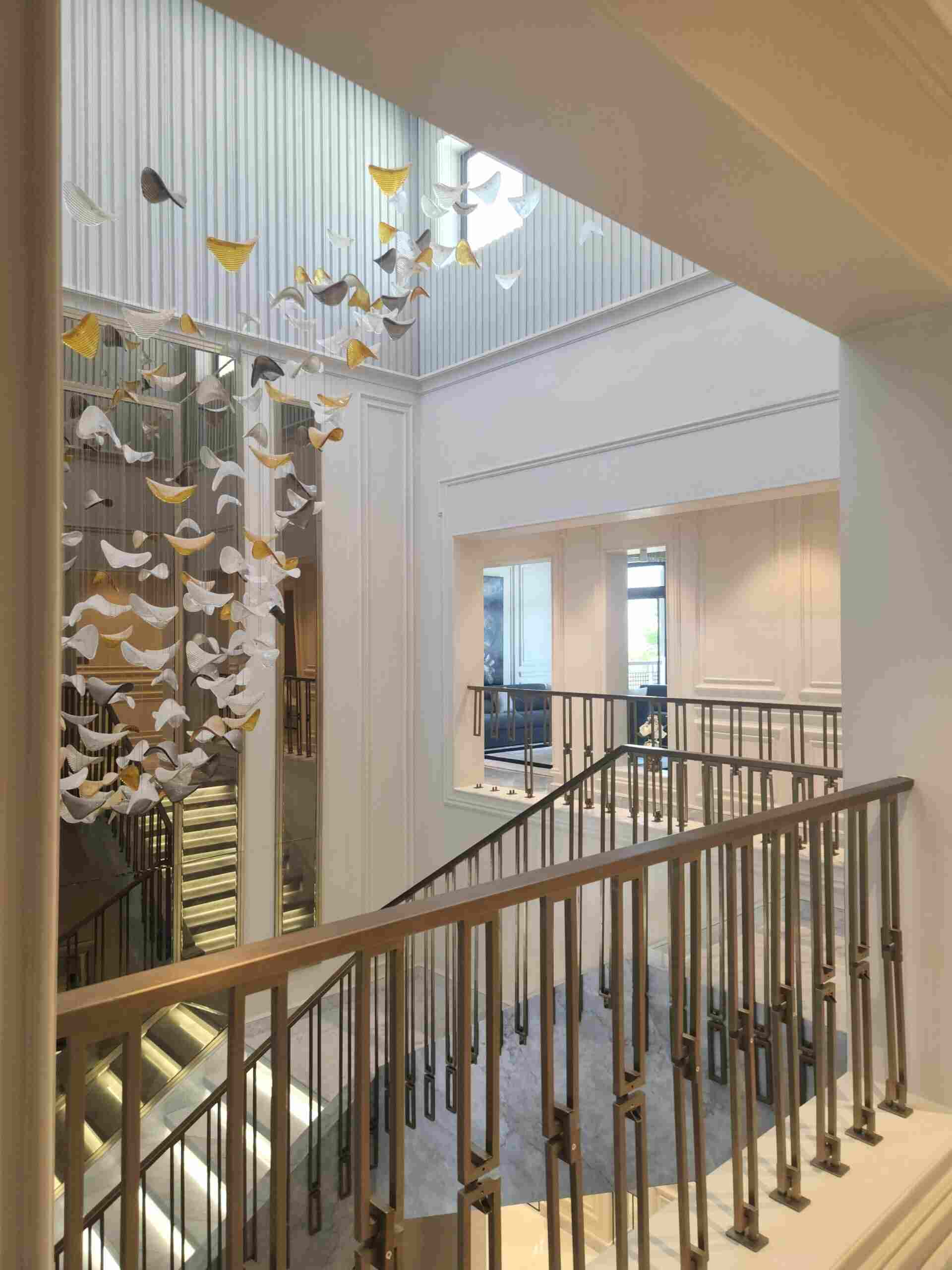 Staircase with chandelier overhead - landscaping services in dubai