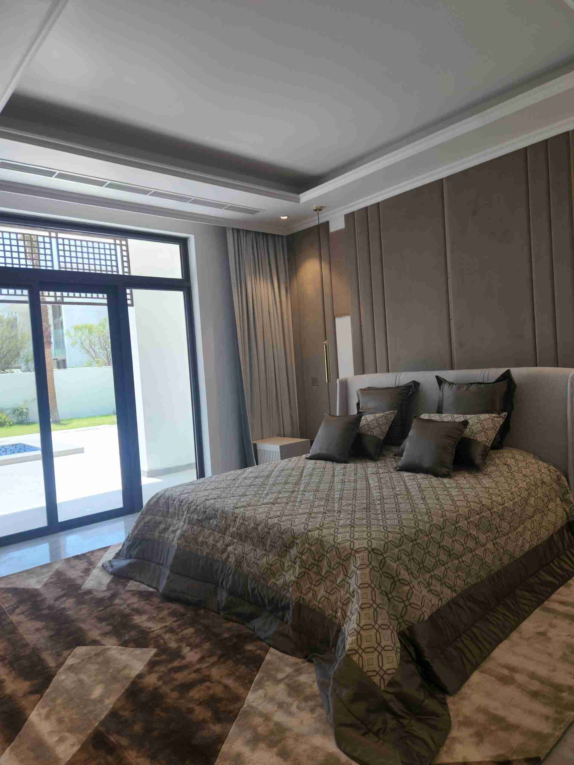 Bedroom with large bed, sliding door - Landscape Design in dubai