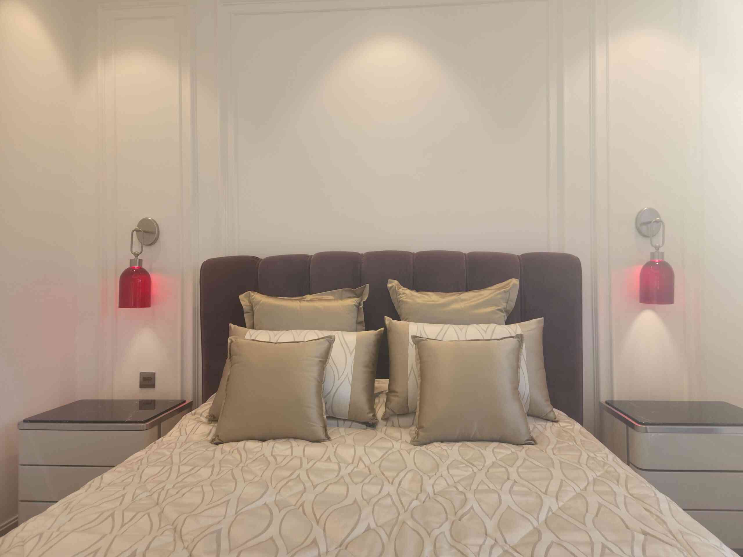 Bedroom with large bed, nightstand - landscaping services in dubai