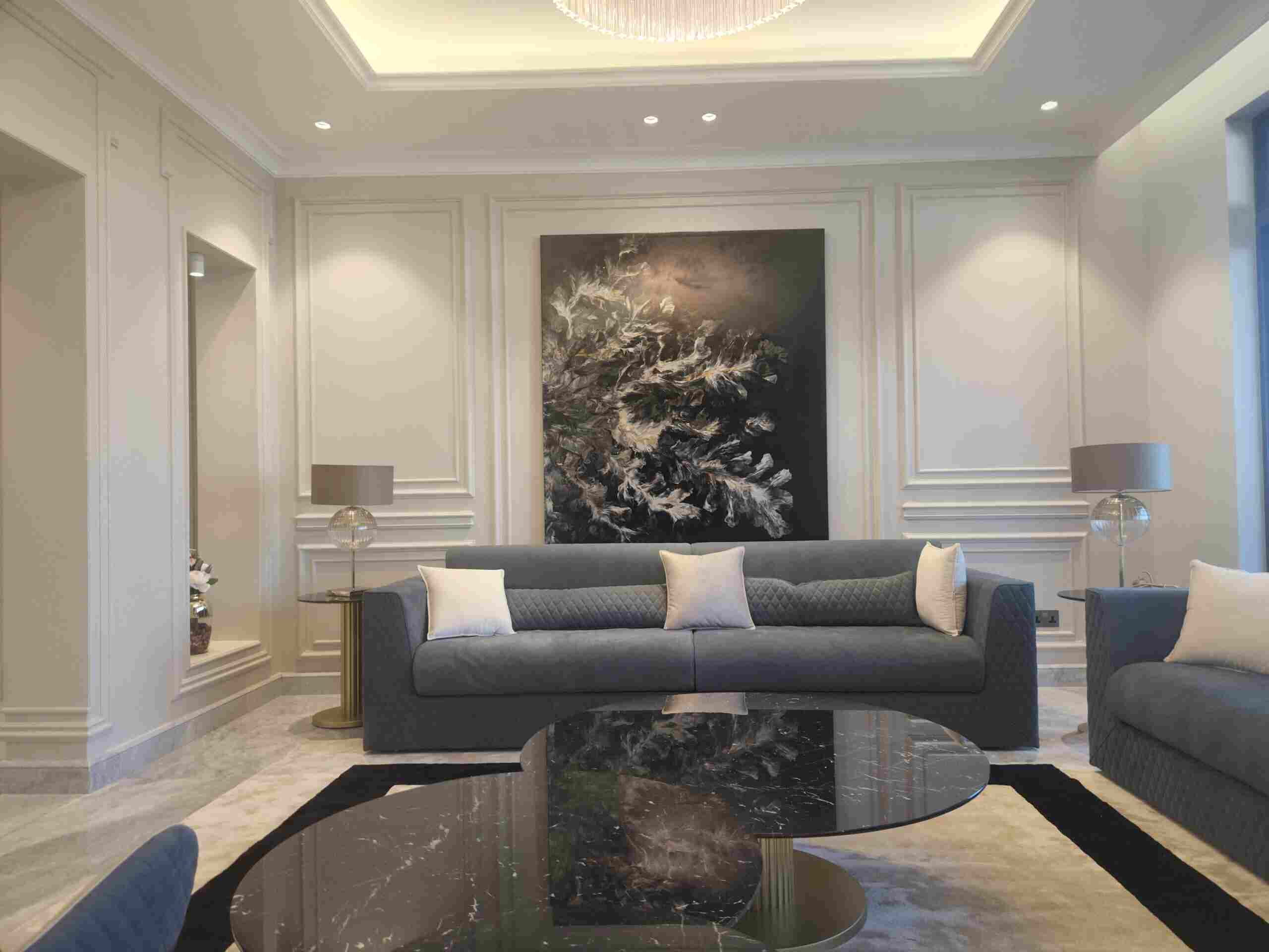 Living room with large painting - Best Landscaping Companies in Dubai